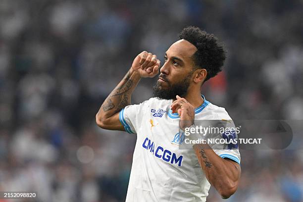 Marseille's French-Gabonese forward Pierre-Emerick Aubameyang celebrates scoring his team's third goal during the French L1 football match between...