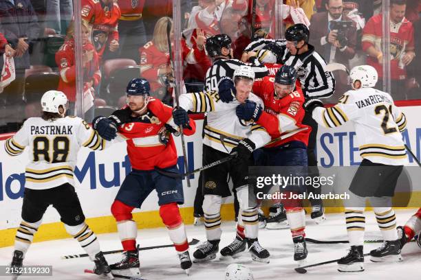 Boston Bruins players fight with Florida Panthers players during the third period in Game Two of the Second Round of the 2024 Stanley Cup Playoffs at...