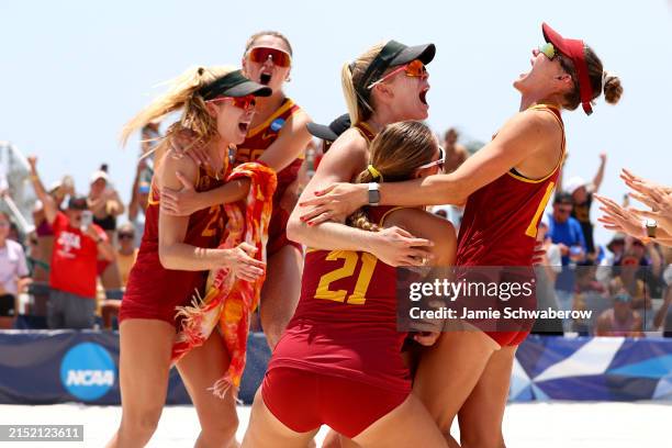 The USC Trojans celebrate after defeating the UCLA Bruins during the Division I Women's Beach Volleyball Championship held at Gulf Shores Public...
