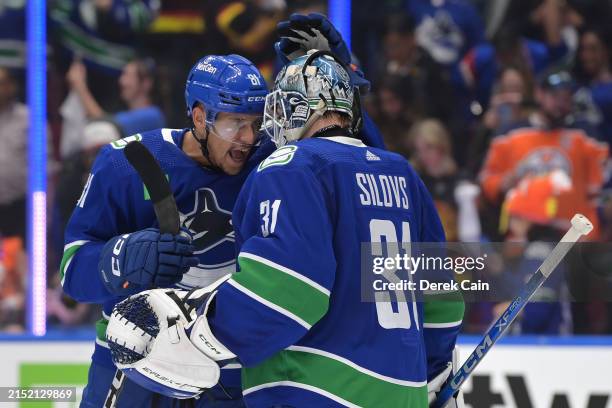 Dakota Joshua and Arturs Silovs of the Vancouver Canucks celebrate their win against the Edmonton Oilers in Game One of the Second Round of the 2024...