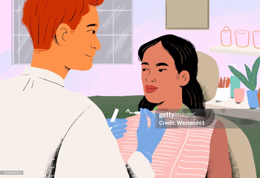 Dentist examining patient in clinic