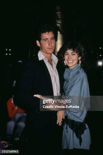 American actor Michael E Knight, wearing a black jacket over a white shirt, open at the collar, and his 'All My Children' co-star, American actress...