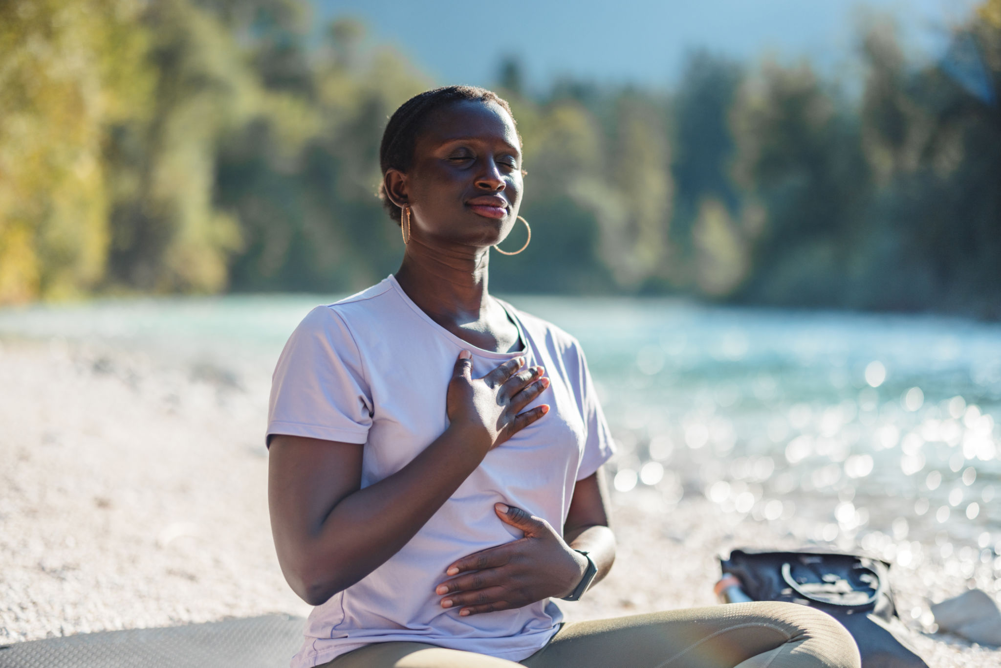 African Woman Practicing Yoga in a Natural Setting African Woman Practicing Yoga in a Natural Setting