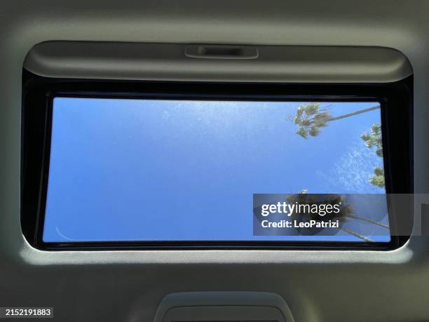 looking up throught the car sunroof - car underside stock pictures, royalty-free photos & images