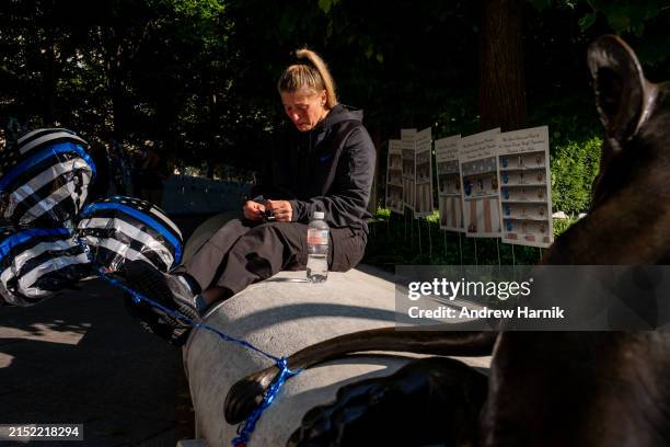 Alicia Marconi, a deputy sheriff from Oneida County, New York, becomes emotional while mourning her friend and coworker Kurt B. Wyman at the start of...