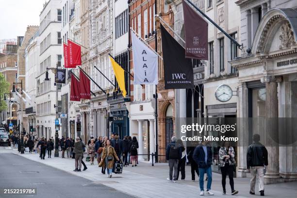 Art gallery and fashion retailers flags on Bond Street on 7th April 2024 in London, United Kingdom. Bond Street is one of the principal streets in...