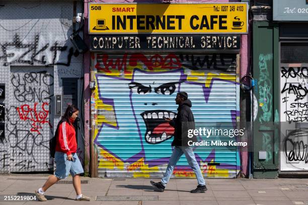 Smart Internet Cafe in Dalston with shutetrs down on 8th May 2024 in London, United Kingdom. Internet cafes were once very popular at the beginning...