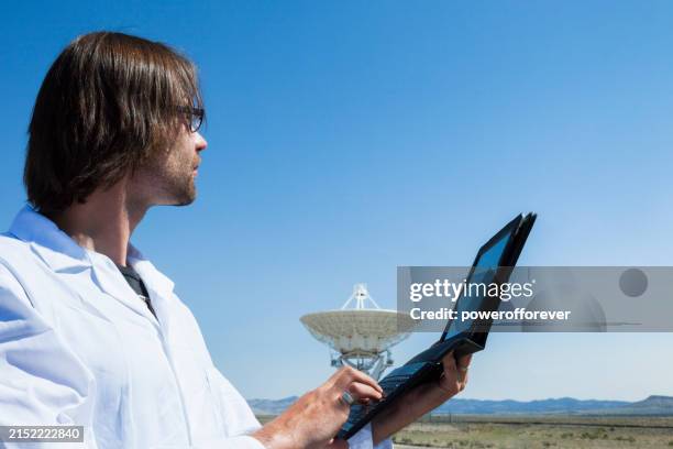 astronomer at the vla radio telescope in new mexico, united states - astronomer stock pictures, royalty-free photos & images