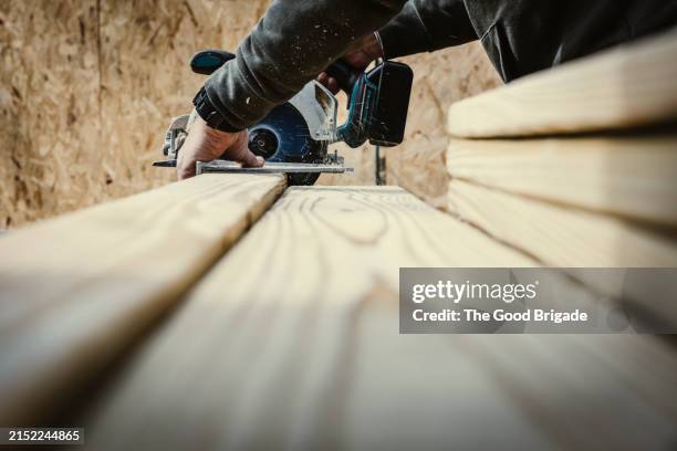 Man Using Saw 6,932 Man Using Circular Saw Stock Photos, High-Res Pictures, and ...