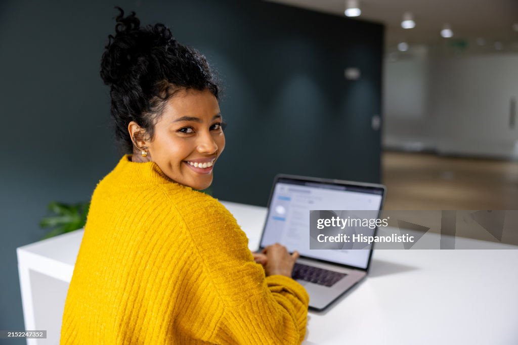 Business woman working on her laptop at a coworking