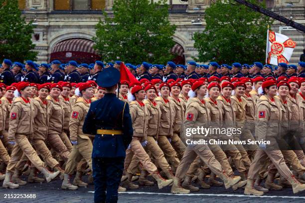 Russian servicewomen march in formation during a Victory Day military parade marking the 79th anniversary of the victory over Nazi Germany in World...