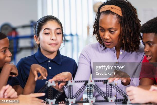 middle school students, teacher, building model bridge - education event stock pictures, royalty-free photos & images