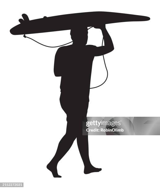 surfer carrying surfboard silhouette - young man surf stock illustrations