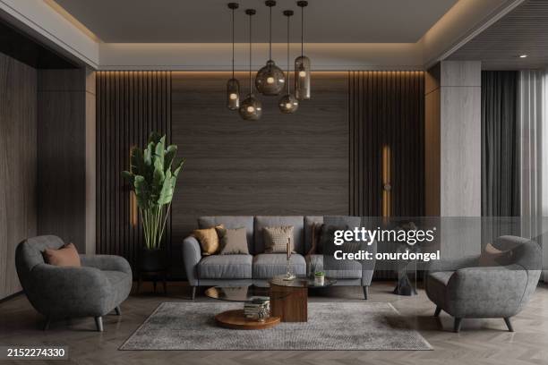 modernes wohnzimmer-interieur mit sofa, sesseln, couchtisch, pendelleuchte und topfpflanze bei nacht - hängelampe stock-fotos und bilder