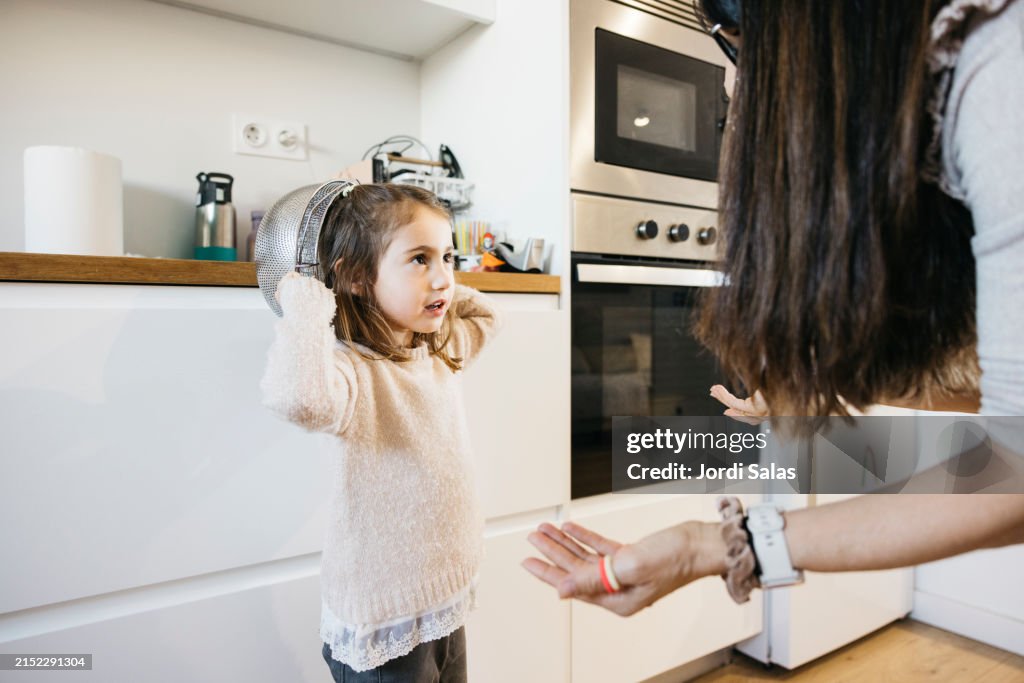 Mother scolding her daugther