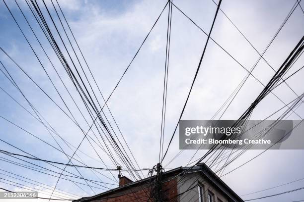 electricity cables on a house - electrical wires bundle stock pictures, royalty-free photos & images