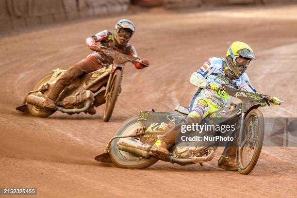 Craig Cook of Oxford Spires, wearing yellow, is leading Norick Blodorn of Belle Vue Aces, in blue, during the Rowe Motor Oil Premiership match...