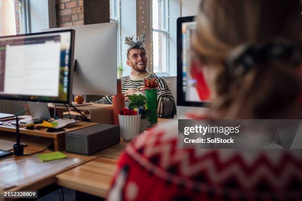cheerful at christmas time - christmas sweater stock pictures, royalty-free photos & images