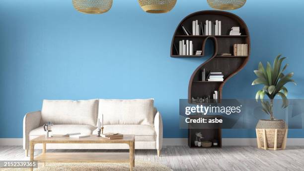 a question mark shaped wooden bookshelf in blue living room - vragen en antwoorden stockfoto's en -beelden
