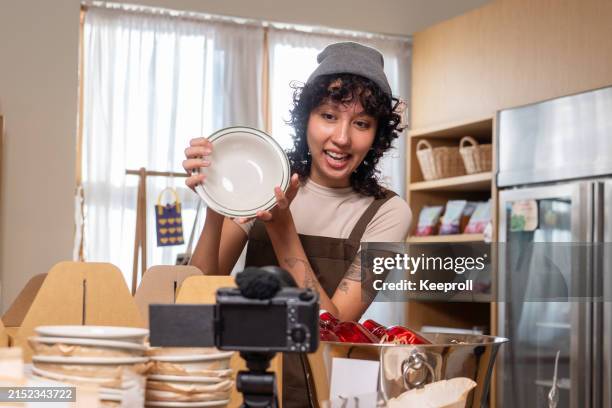 asian woman doing live streaming for online selling - side hustle stock pictures, royalty-free photos & images