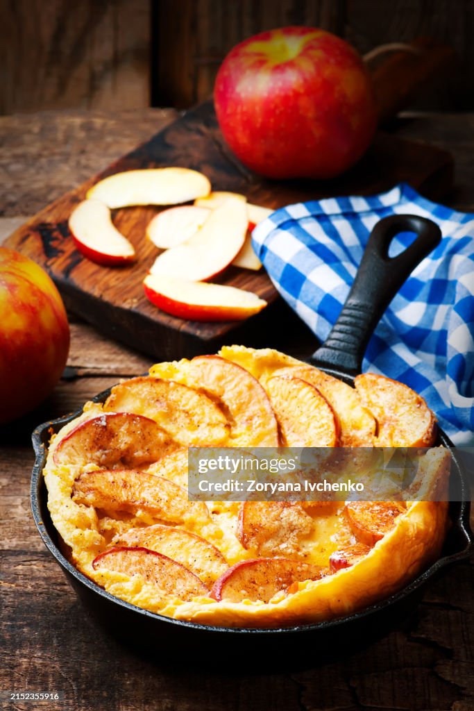 Cinnamon Apple Dutch Baby Pancake in iron pan