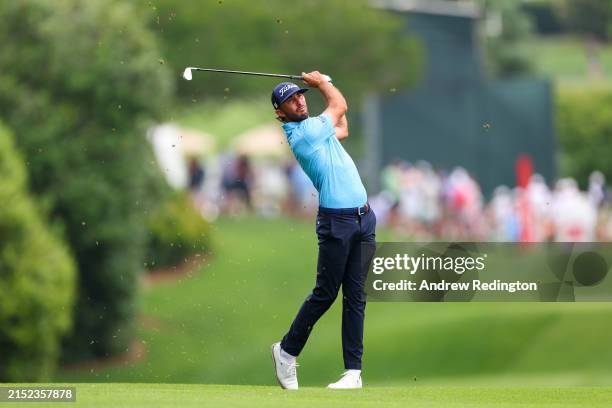 Max Homa hits an approach shot on the 11th hole during the second round of the Wells Fargo Championship at Quail Hollow Country Club on May 10, 2024...