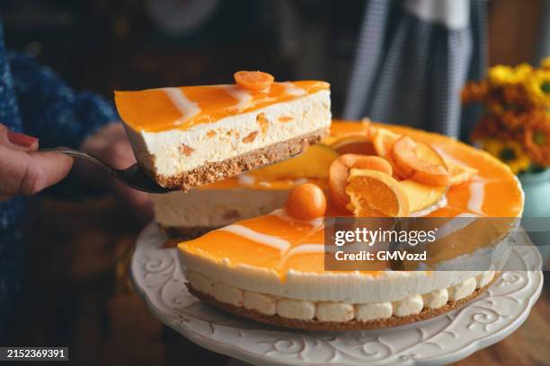 creamy orange cheesecake with whipped cream - obsttorte stock-fotos und bilder