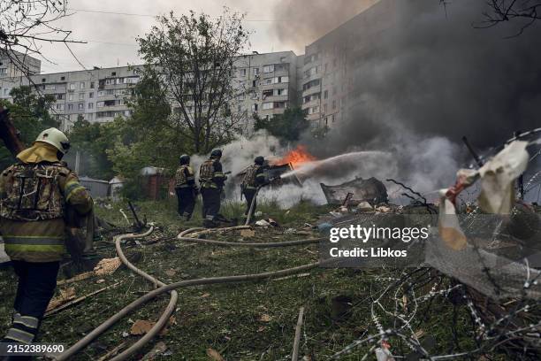 Emergency services fight a fire following a Russian air strike on May 14, 2024 near Kharkiv, Ukraine. Around 16:00hrs on May 14, the Russian military...