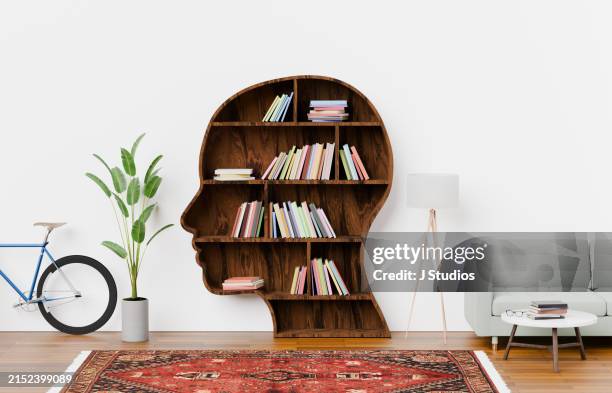 head shaped book shelf in living room - bookshelf stock pictures, royalty-free photos & images
