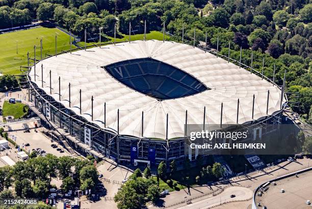 An aerial view shows the 'Volksparkstadion', home stadium of German football club Hamburger SV, taken from a plane on May 14, 2024 in Hamburg,...