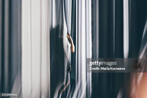 beautiful woman in a dress among the light fabric. - long white silk dress stock pictures, royalty-free photos & images