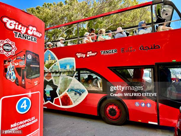 Stop in the Hafa district for the red City Tour Tanger double-decker tourist bus showing tourists around the city, Tangier Morocco, on 12 May 2024.