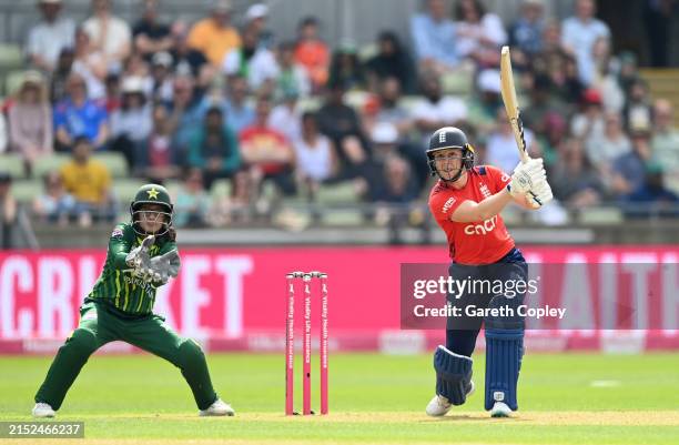 Heather Knight of England bats watched by Pakistan wicketkeeper Muneeba Ali during the 1st Women's Vitality IT20 match between England and Pakistan...