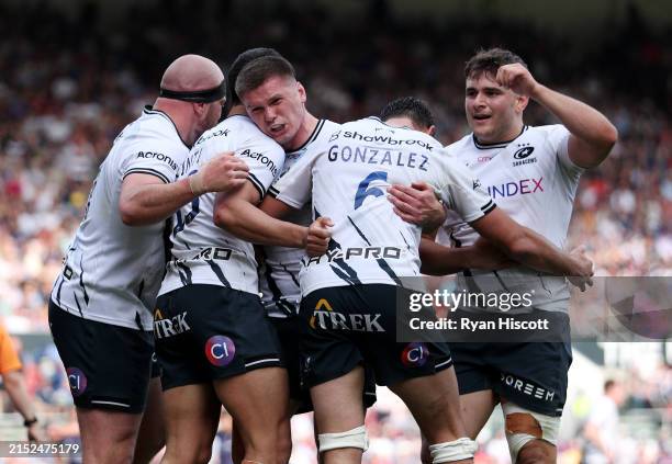 Juan Martin Gonzalez of Saracens celebrates scoring his team's fourth try with teammates Oli Hoskins, Lucio Cinti, Owen Farrell and Theo Dan during...