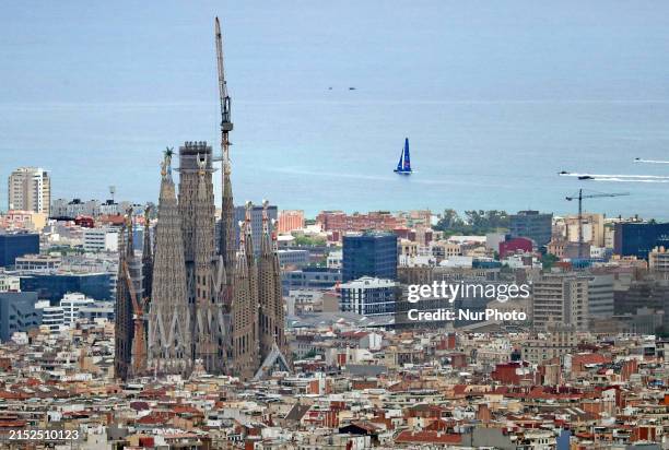 View of the Sagrada Familia in Barcelona, Spain, while the Alinghi Red Bull sailboat is participating in the 37th edition of the America's Cup...
