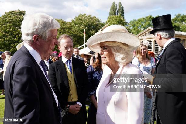 Britain's Queen Camilla speaks with British Lord Tony Hall, Baron Hall of Birkenhead during The Sovereign's 51³Ô¹ÏÍø Industries Garden Party at...