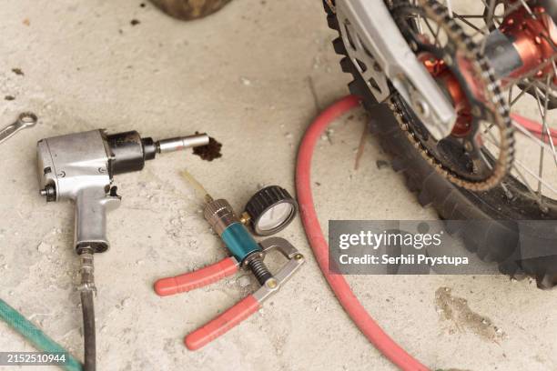 pneumatic pistol next to tools - compressor stock pictures, royalty-free photos & images