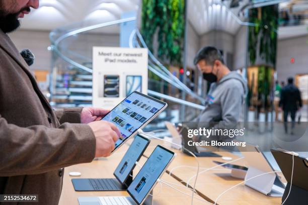 Customer looks at an Apple iPad Pro M4 at Apple's Fifth Avenue store in New York, US, on Wednesday, May 15, 2024. Apple Inc. Released a new...