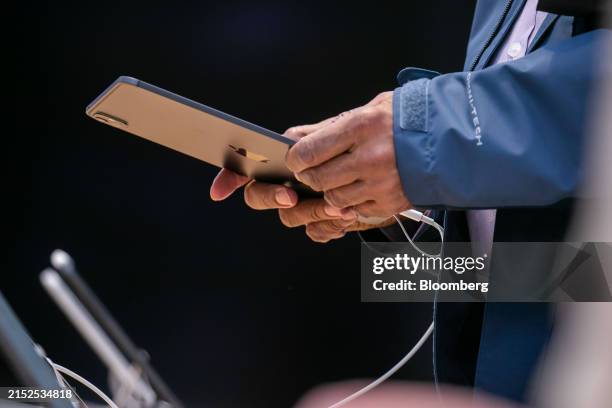 Customer holds an Apple iPad Pro M4 at Apple's Fifth Avenue store in New York, US, on Wednesday, May 15, 2024. Apple Inc. Released a new artificial...