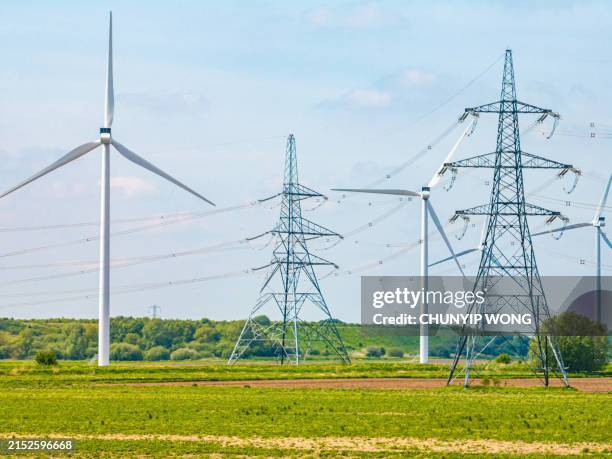 electric high voltage tower with electric line near keadby power station, england, uk - grid pattern stock pictures, royalty-free photos & images