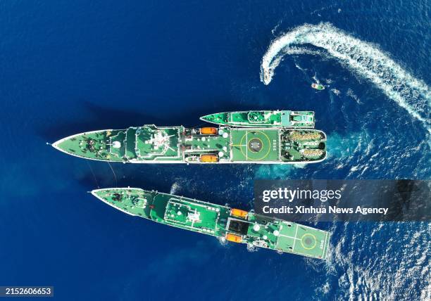 An aerial drone photo taken on May 13, 2024 shows the vessel "China Coast Guard CCG 3502" carrying out replenishment for other vessels in the South...