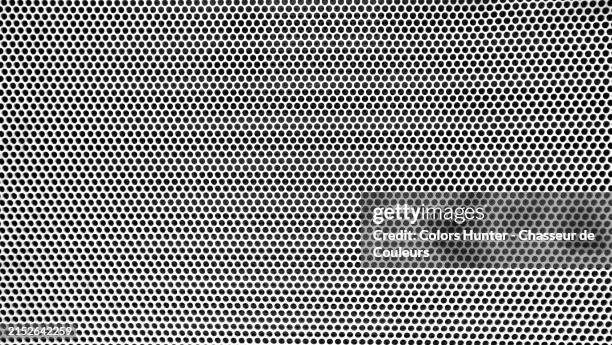 close-up of a white and perforated metal plate on a black background. sunlight. natural colors.
manhattan, new york state, united states.
full frame 16x9 - metal plate stock pictures, royalty-free photos & images