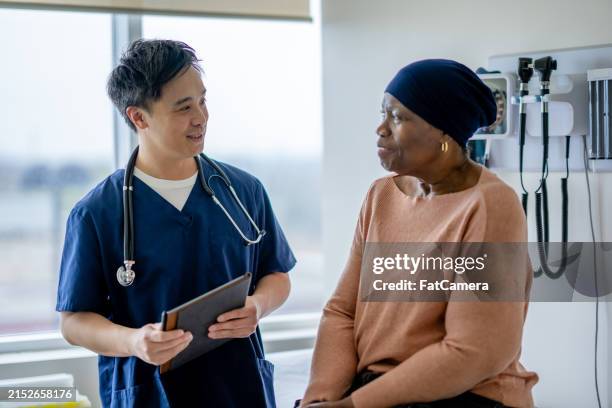 senior oncology appointment - oncologist stock pictures, royalty-free photos & images