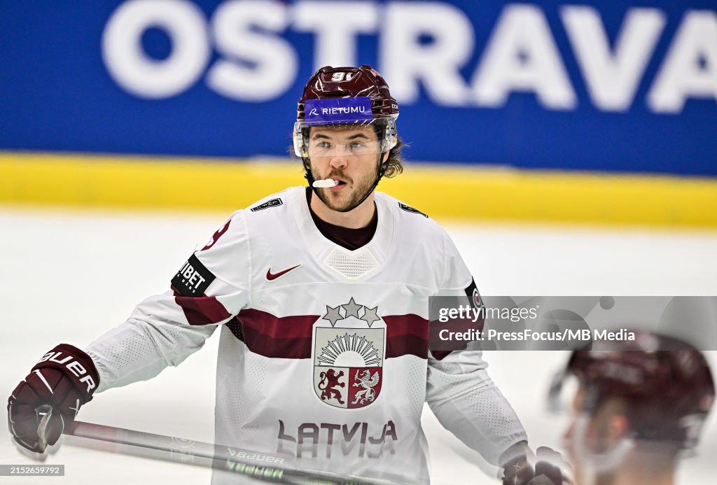 Renars Reksna Renars Krastenbergs of Latvia looks on during the 2024 IIHF Ice... News ...
