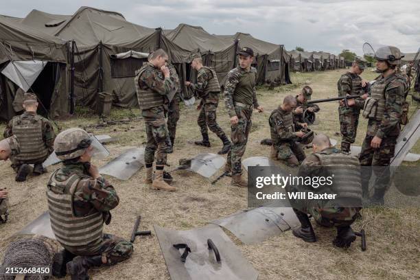 Members of Moldova's 22nd Peacekeeping Battalion gear up for a crowd control training on May 16, 2024 in Bulboaca, Moldova. The country is...