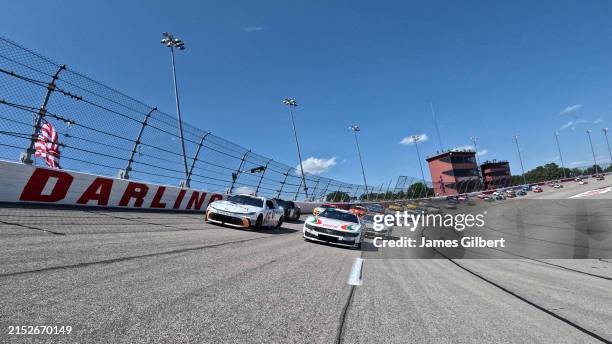 Tyler Reddick, driver of the MoneyLion Toyota, and Brad Keselowski, driver of the Castrol Ford, leads the field on a pace lap prior to the NASCAR Cup...