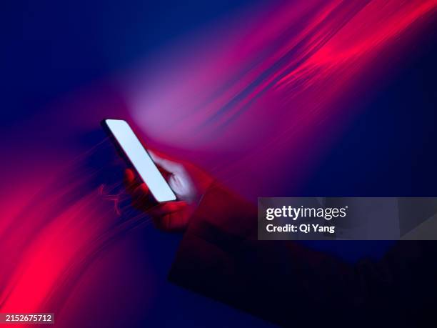 fiber optic long exposure, close-up using smartphone - mobile phone neon glow stock-fotos und bilder