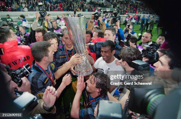 Brazilian footballer Ronaldo and his Inter Milan teammates celebrate with the trophy after the UEFA Cup Final, between Lazio and Inter Milan, at the...