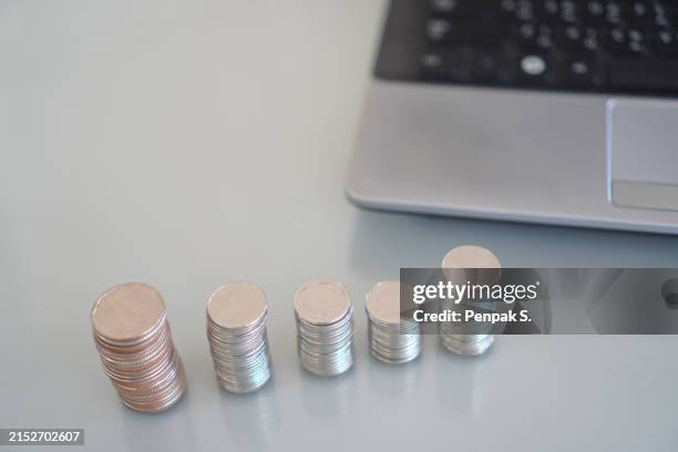 many coins are stacked rows orderly reflection on blurred background - silver medal stock pictures, royalty-free photos & images