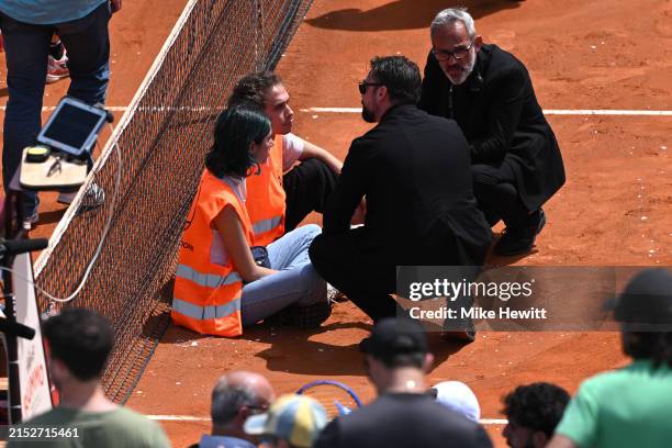Protesters block the court during the Men's Doubles Round of 16 match between Marcelo Arevalo of El Salvador and Mate Pavic of Croatia and Santiago...